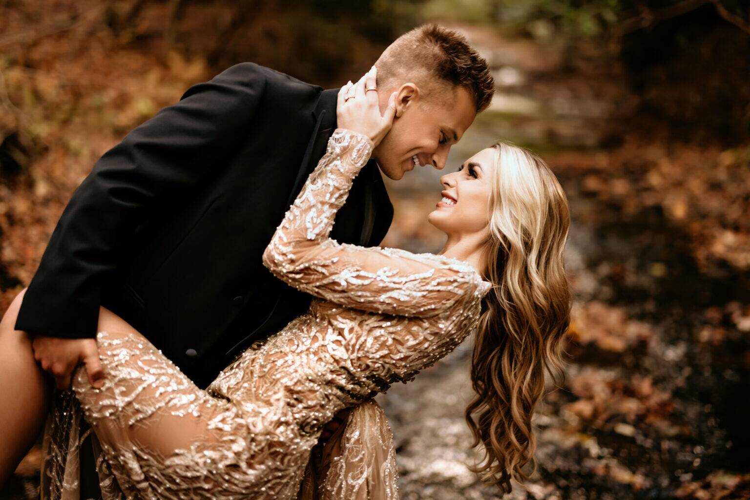 Wedding couple sharing a moment in a natural forest setting
